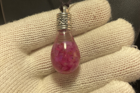 Ruby UV reactive Globe Amulet