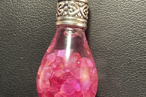 Ruby UV reactive Globe Amulet